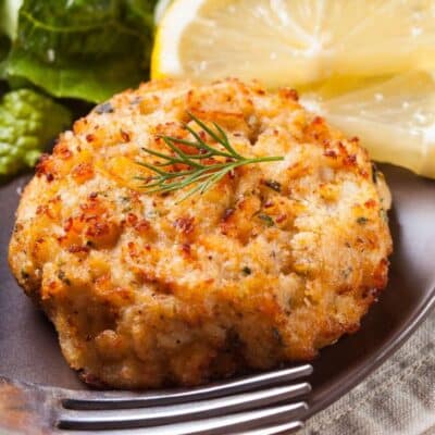 Square image of a crab cake on a plate.