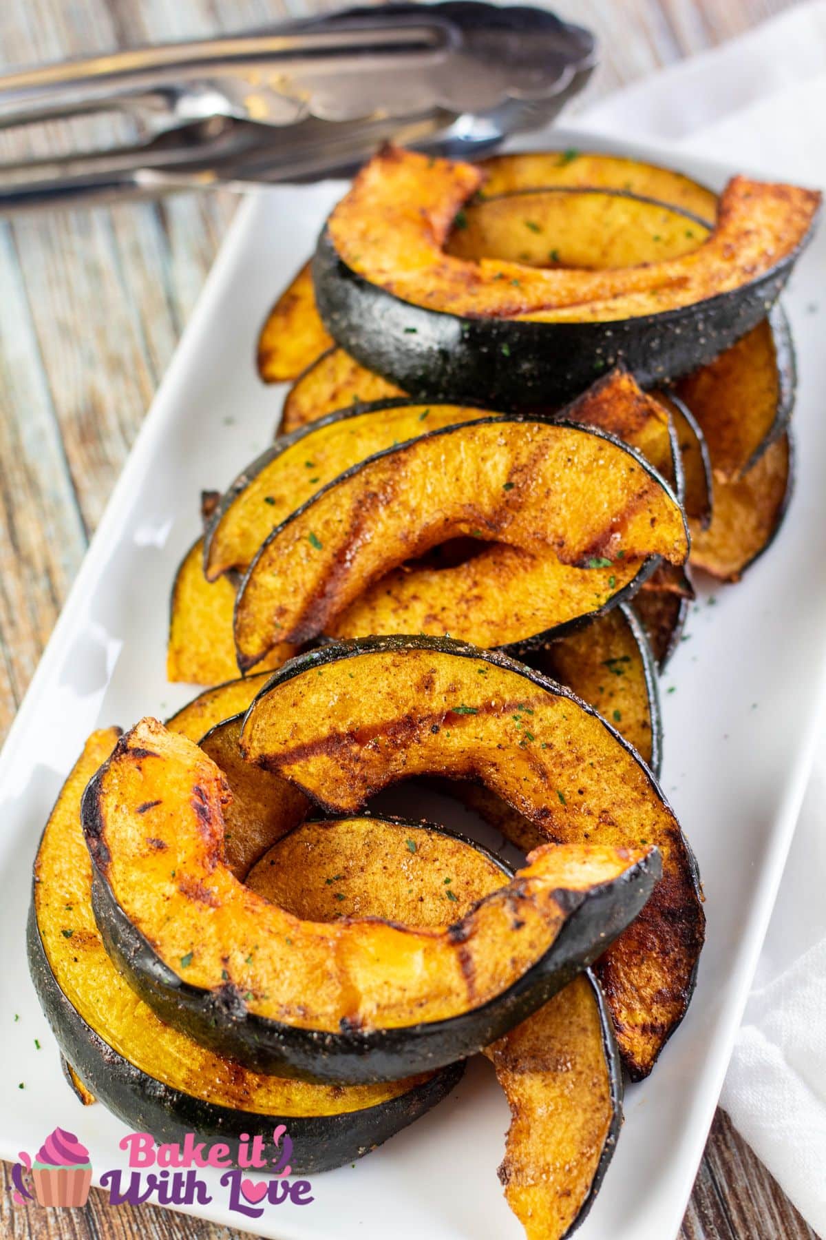 Tall image of grilled acorn squash.