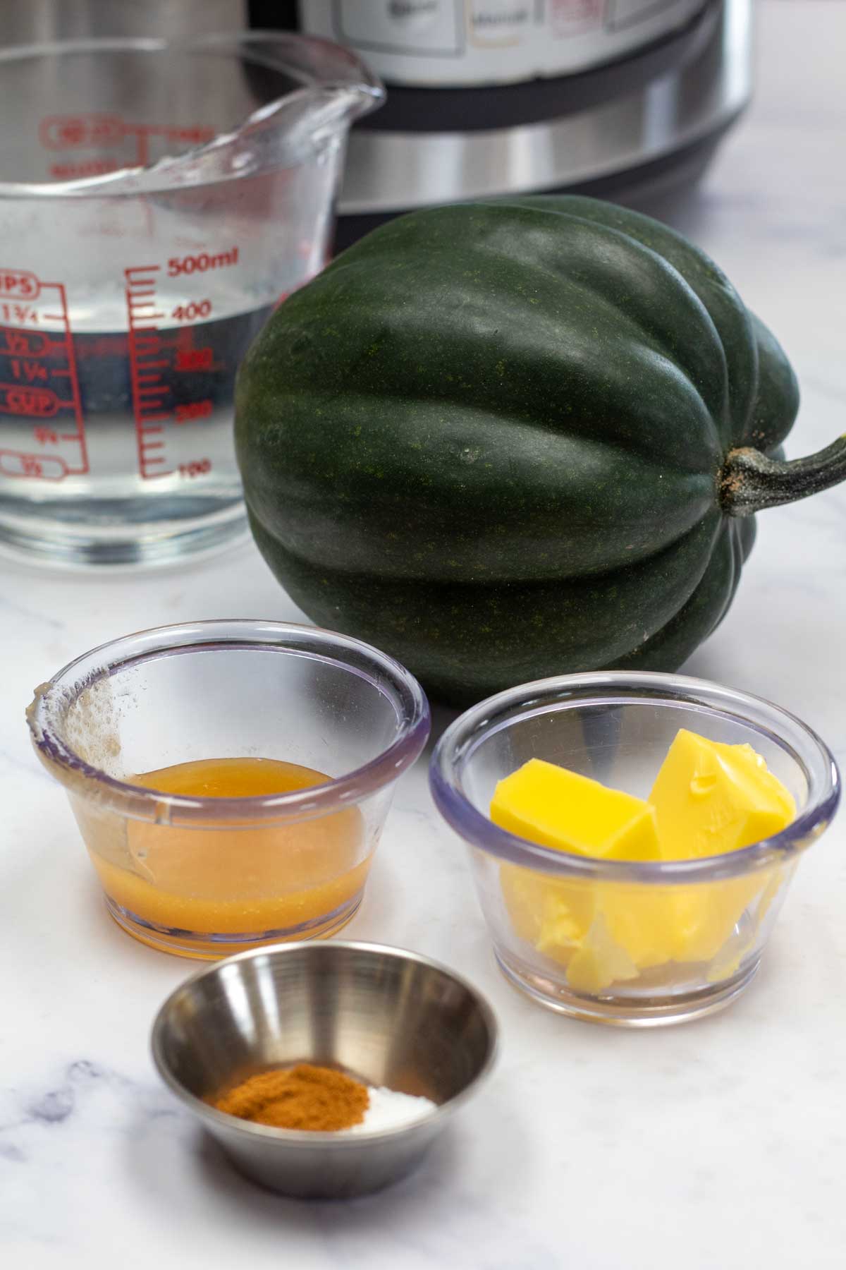 Tall image of instant pot acorn squash ingredients.