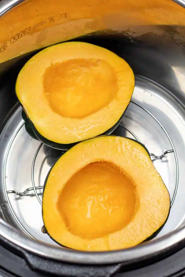 Process image 3 showing placing acorn squash on a trivet in the instant pot.