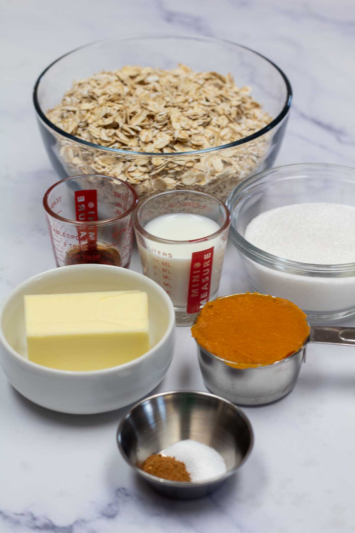 Tall image showing ingredients needed for no bake pumpkin cookies.