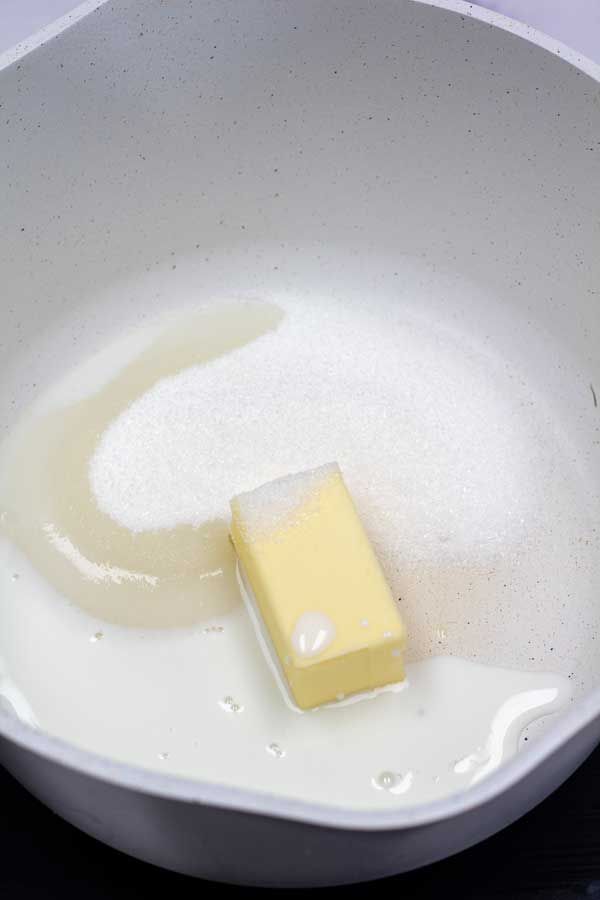 Process image 1 showing butter and sugar in a cooking pot.