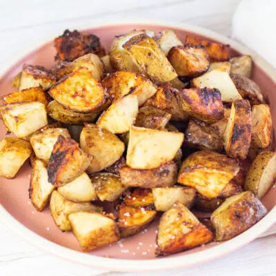Square image of onion soup mix roasted potatoes on a plate.