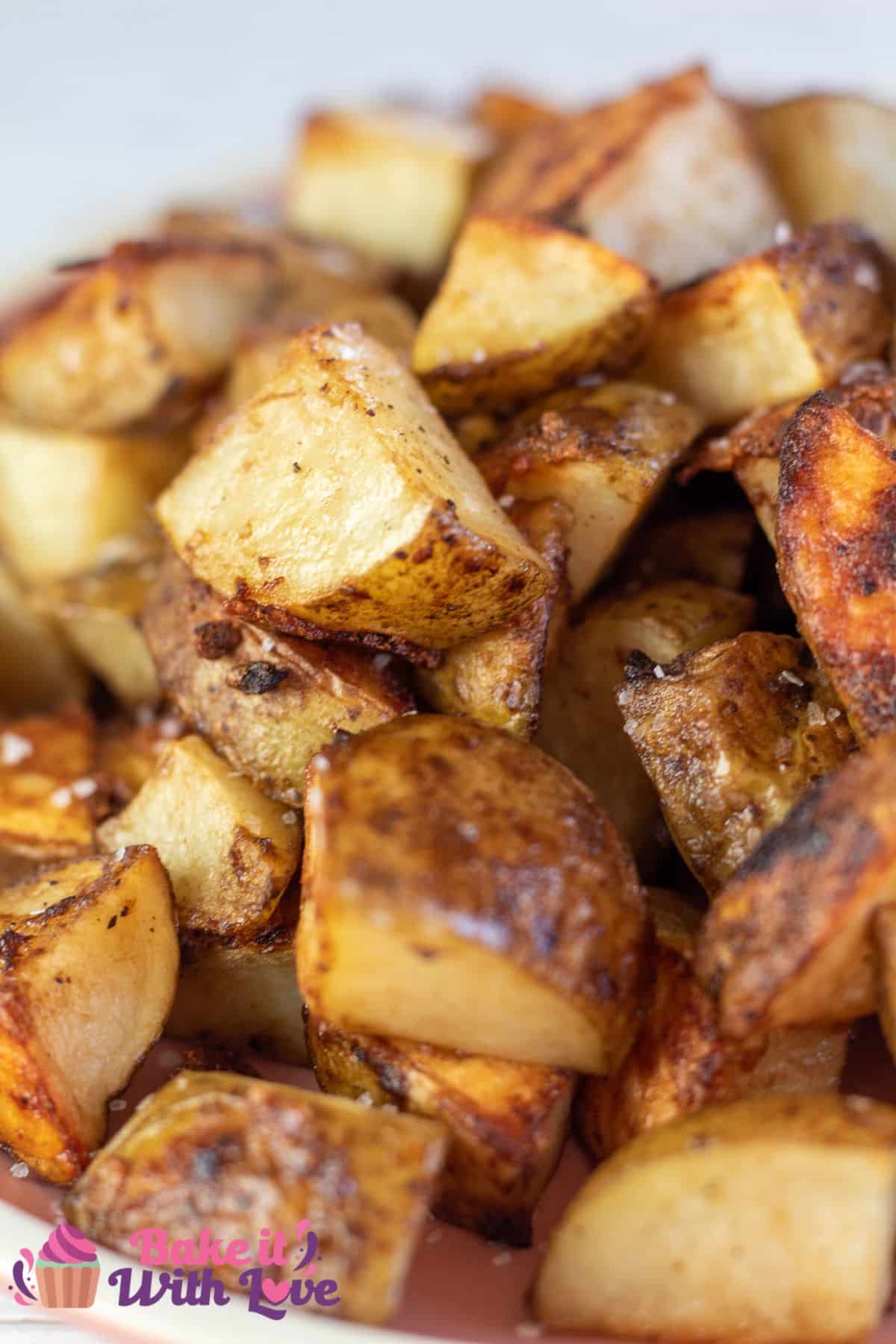 Tall image of onion soup mix roasted potatoes on a plate.