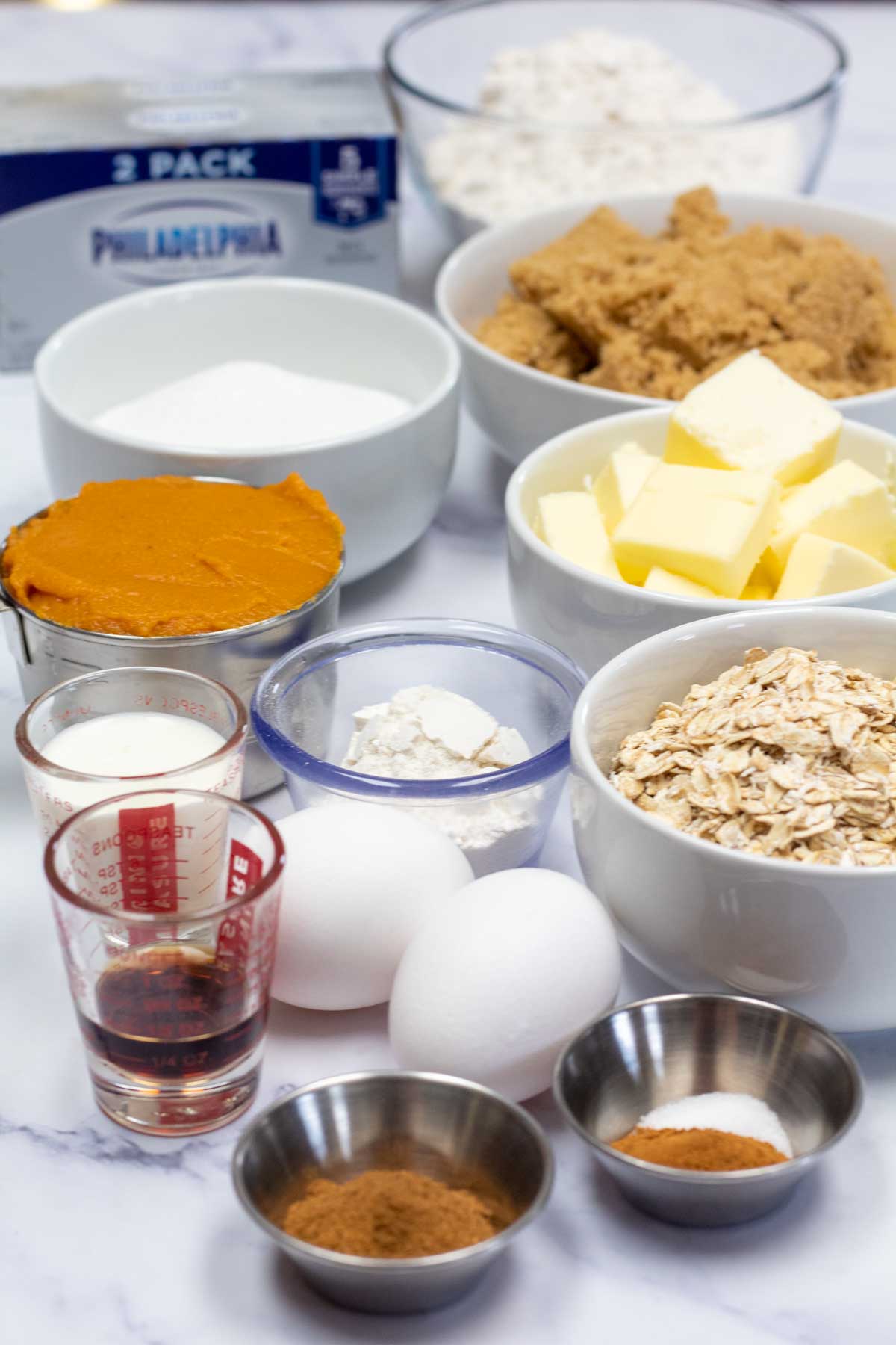 Tall image showing ingredients needed for pumpkin streusel bars.