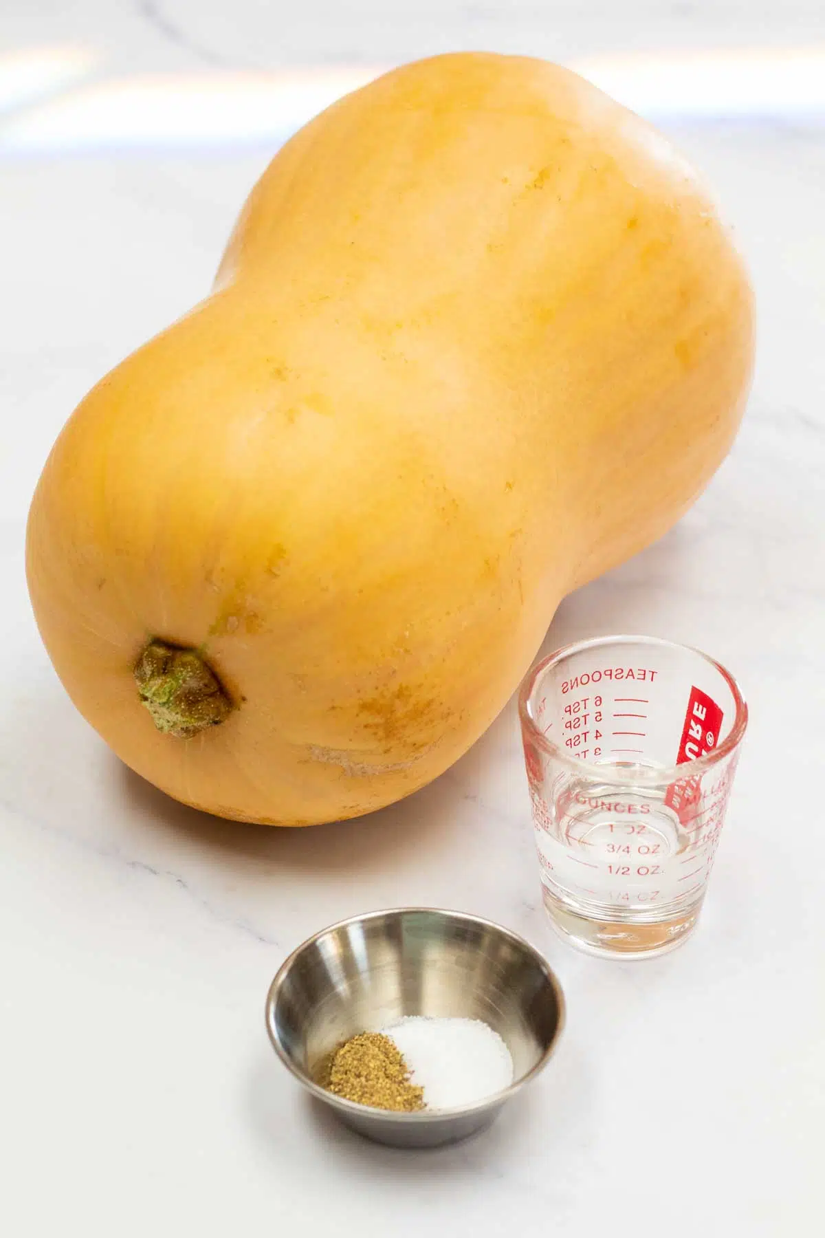 Tall image showing ingredients needed for roasted butternut squash.