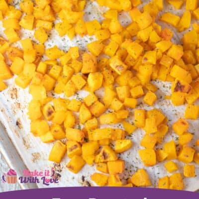 Pin image of roasted butternut squash on a baking sheet.