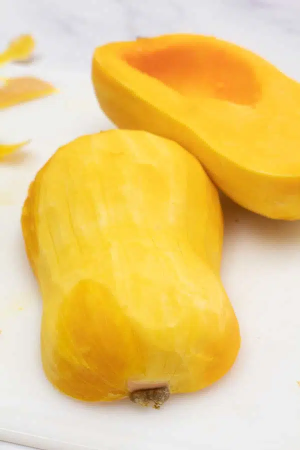 Process image 4 showing butternut squash during peeling of the skin.