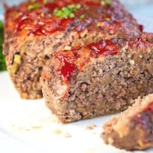 Square image of sliced meatloaf.