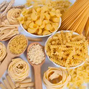 Square image of a variety of pasta on a white background.