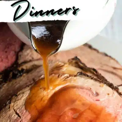 Best British Christmas dinner menu ideas pin with au jus pouring over a tasty prime rib roast.