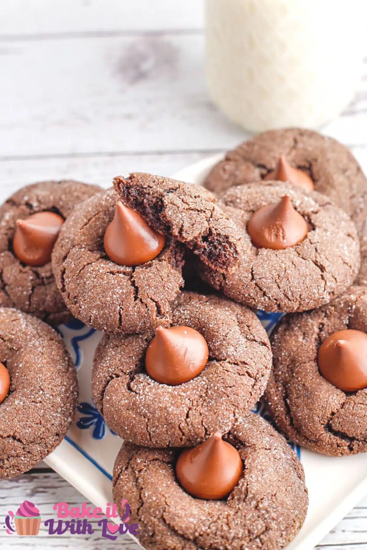 Best chocolate blossom cookies on serving plate and light background with glass of milk in the background.