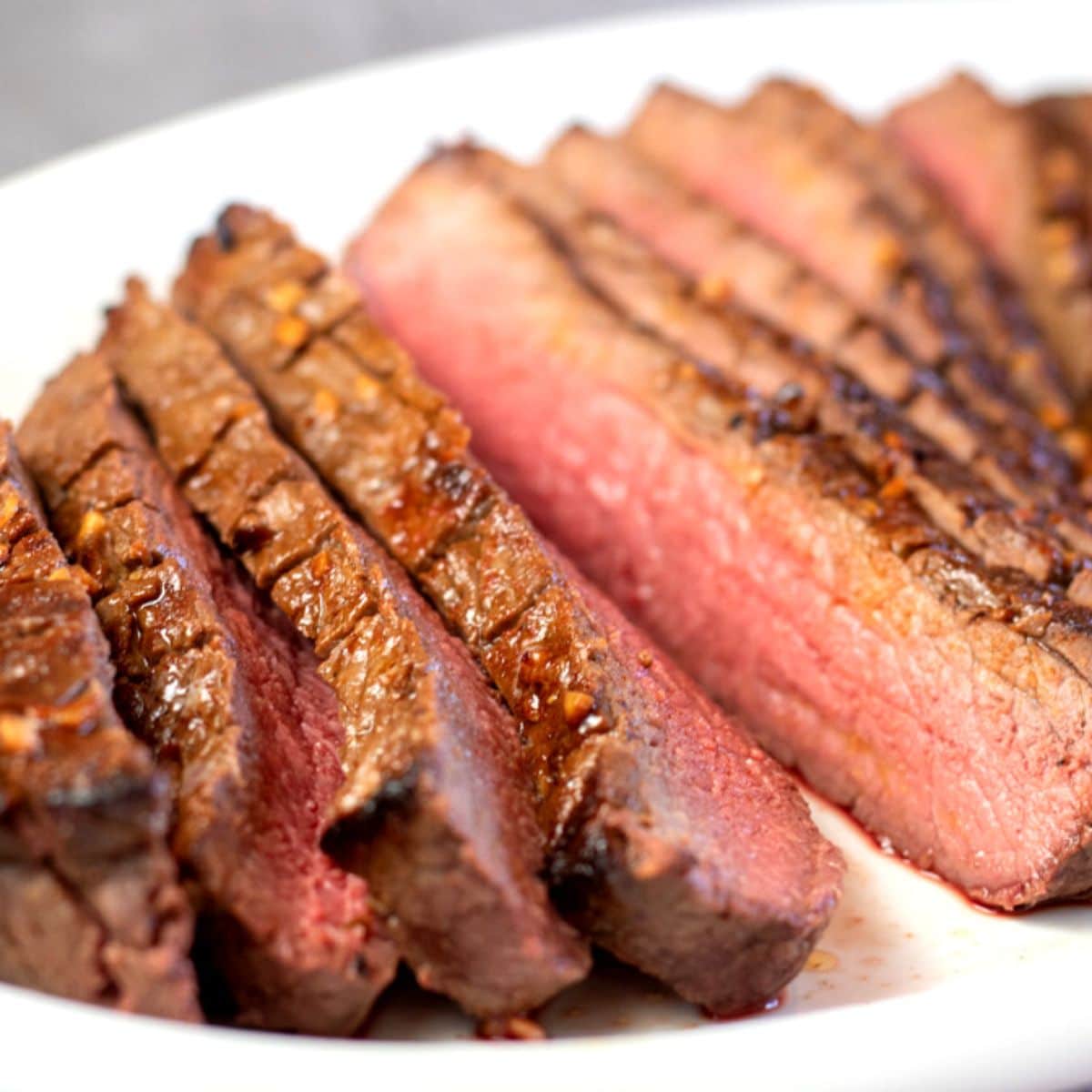 How to tenderize london broil so it's juicy and tender when sliced and served like this medium rare steak.