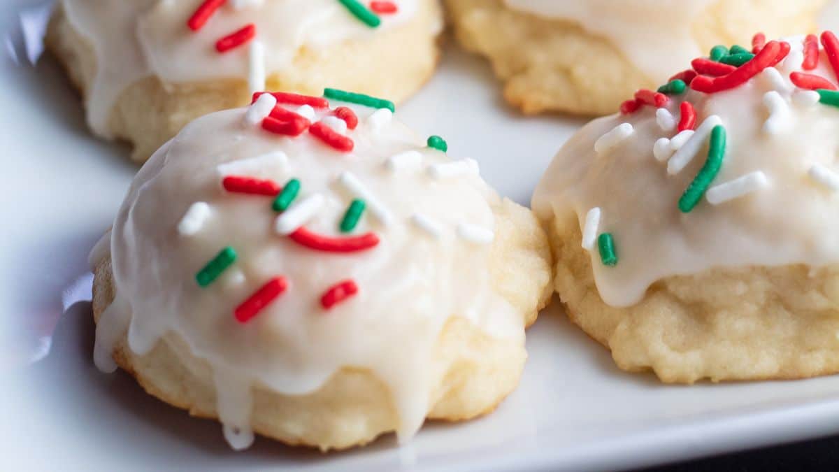 Best Italian Christmas cookies to bake like these tender, tasty Italian ricotta cookies with icing and sprinkles.