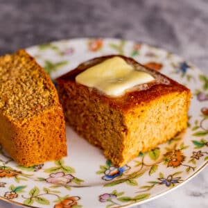 Best sweet potato cornbread recipe sliced and served with rich butter.