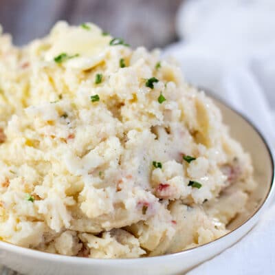 Square image of bacon cream cheese mashed potatoes.