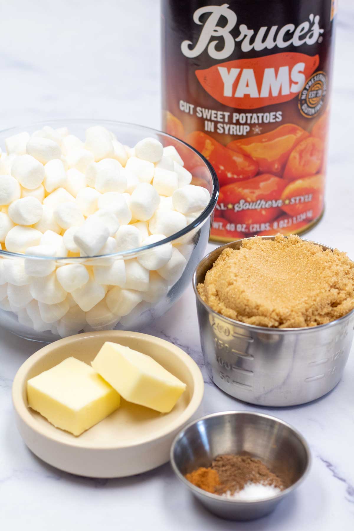 Tall image showing ingredients needed for candied yams with brown sugar.