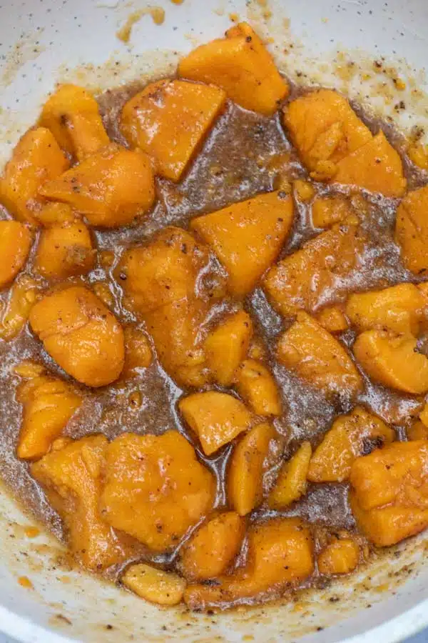 Process image 3 showing yams and sugar combined in a mixing bowl.