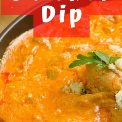 Pin image of buffalo chicken dip in a black bowl with celery.