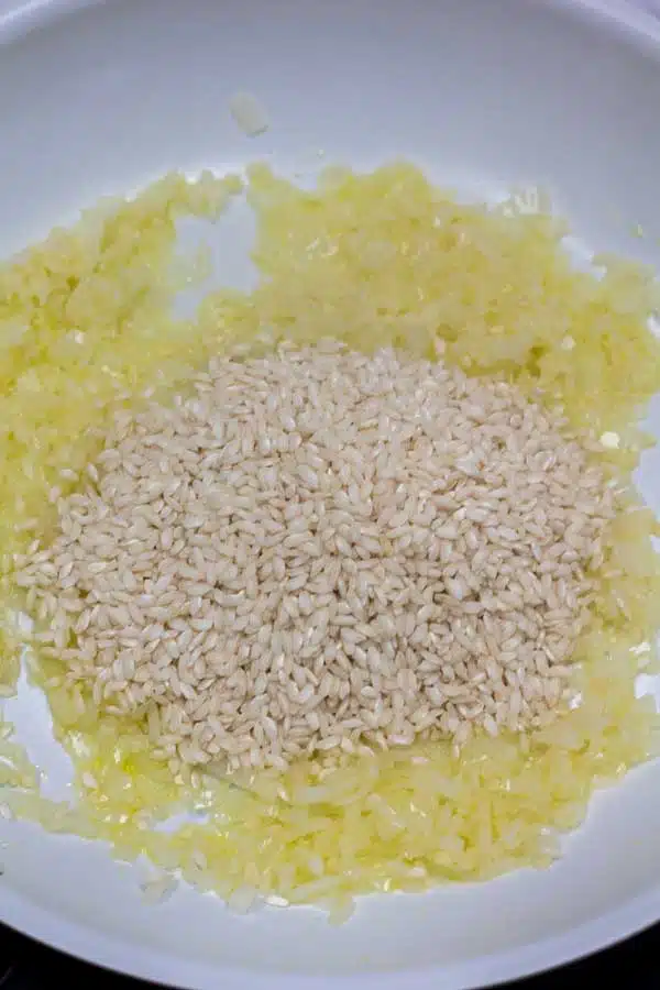 Process image 3 showing adding arborio rice.