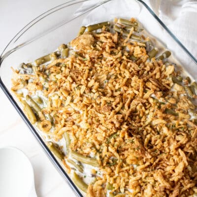 Square image of Campbell's green bean casserole in a glass baking dish.