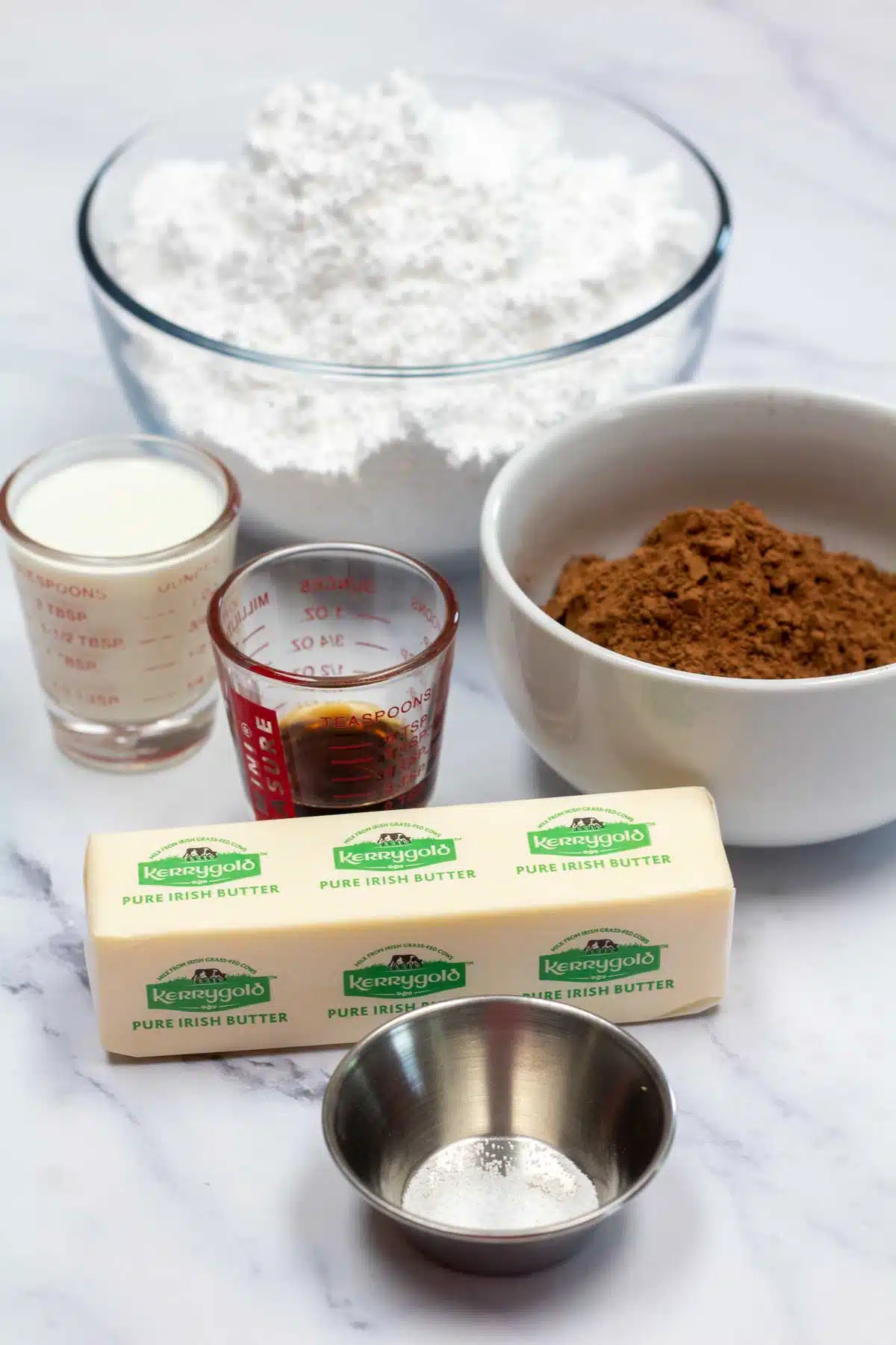 Tall image showing ingredients needed for chocolate frosting.