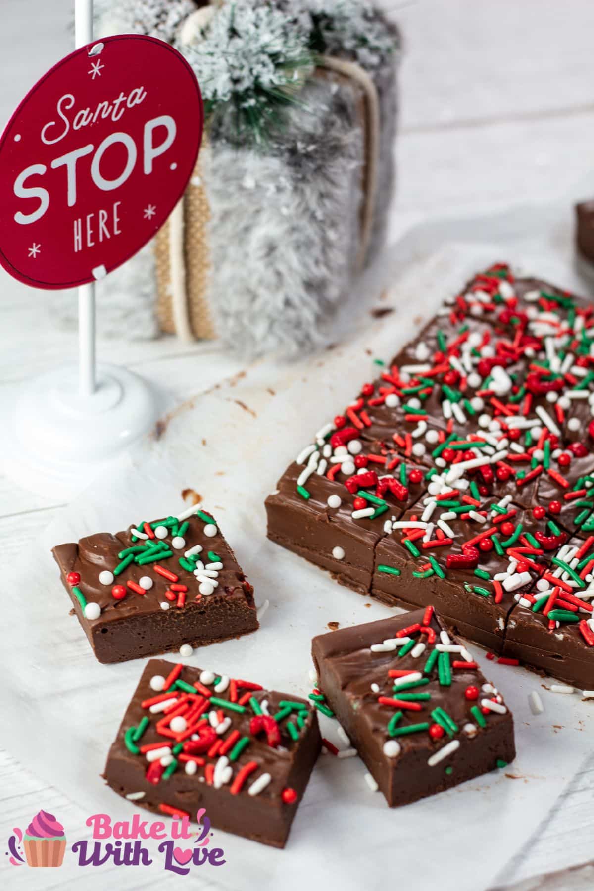 Tall image of Christmas fudge with sprinkles.