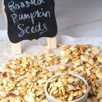 Tall image of ranch roasted pumpkin seeds.