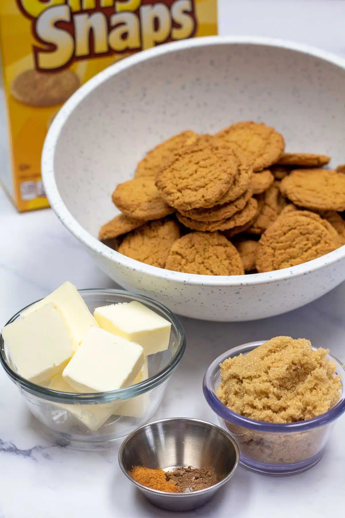Tall image of gingersnap cookie pie crust ingredients.