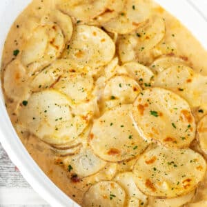 Close up square image of instant pot potatoes au gratin.