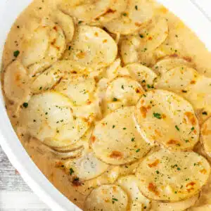 Close up square image of instant pot potatoes au gratin.
