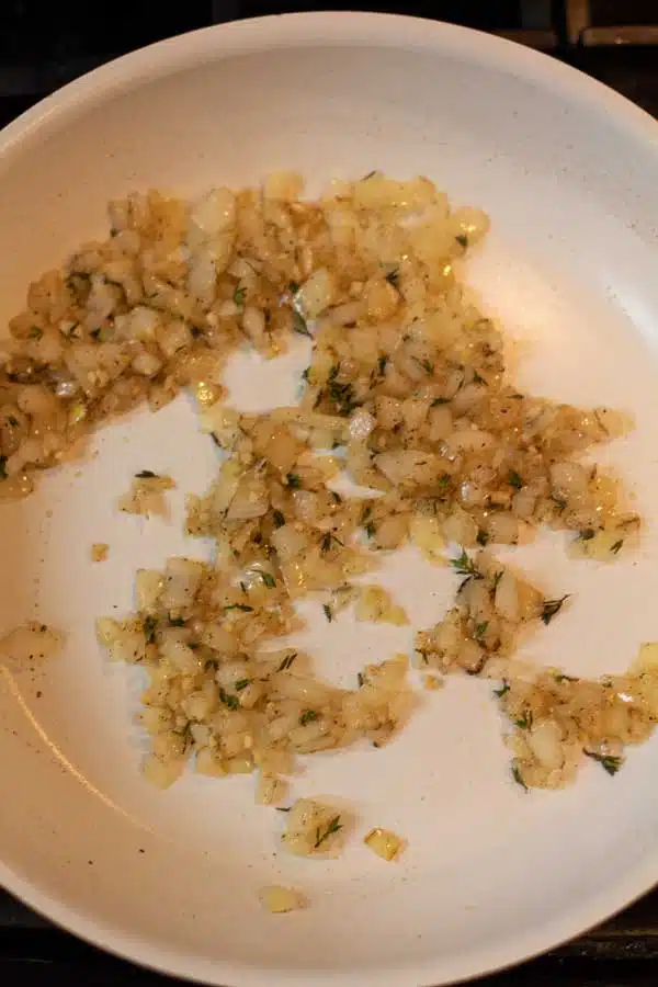 Process image 5 showing combined seasoning with sauteed onion.