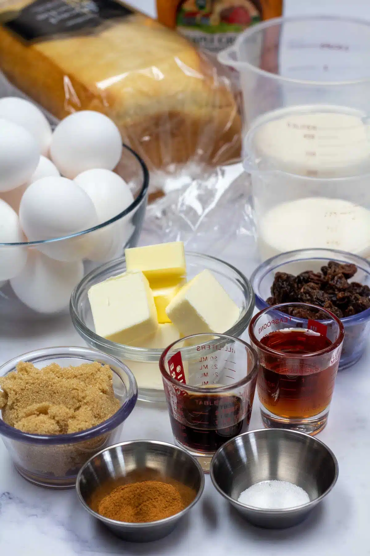 Tall image showing ingredients needed for overnight french toast bake.