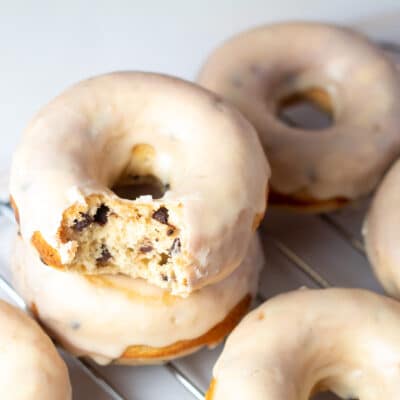Square image of peanut butter & chocolate chip baked donuts.
