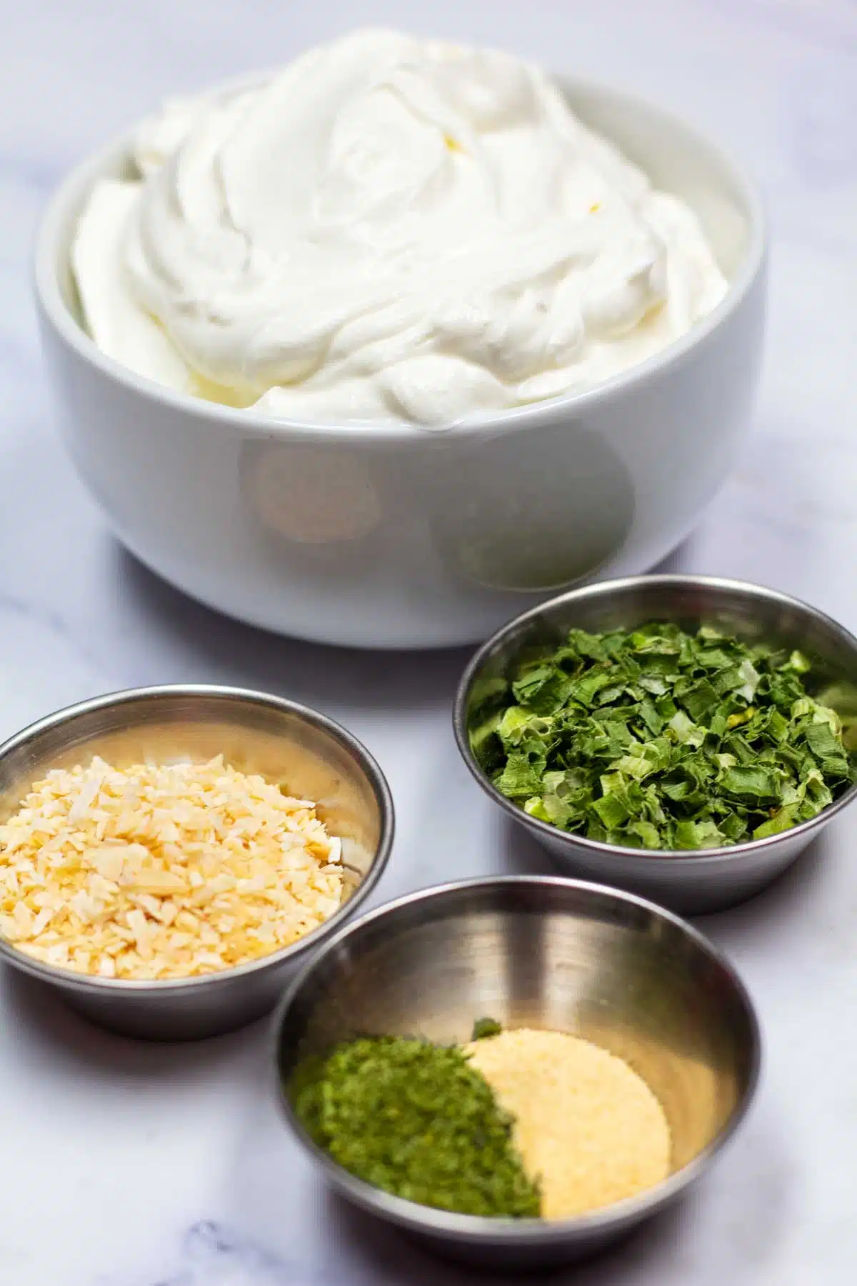 Tall image of ingredients needed for sour cream chip dip.