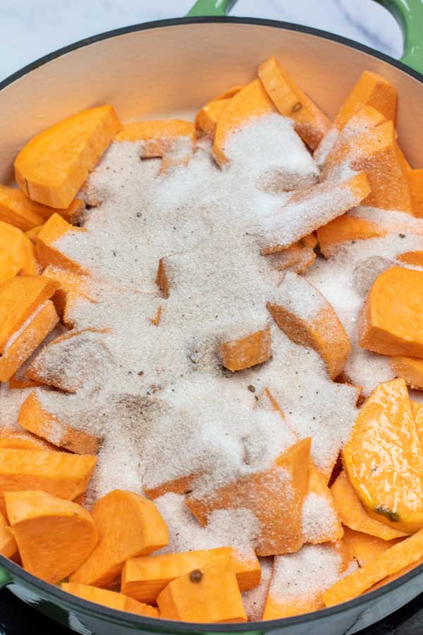 Process image 4 showing cinnamon sugar added to sweet potatoes.