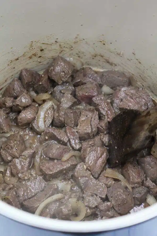 Process image 3 showing browning beef chunks.