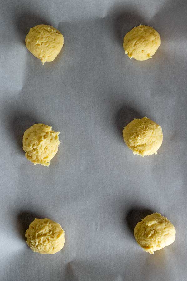 Process image 9 showing portioned cookie dough balls on baking sheet.