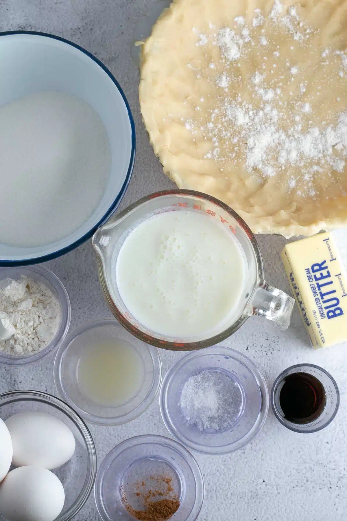 Tall image of ingredients needed for buttermilk pie.