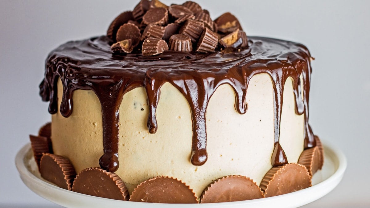 Horizontal image of chocolate peanut butter drip cake.