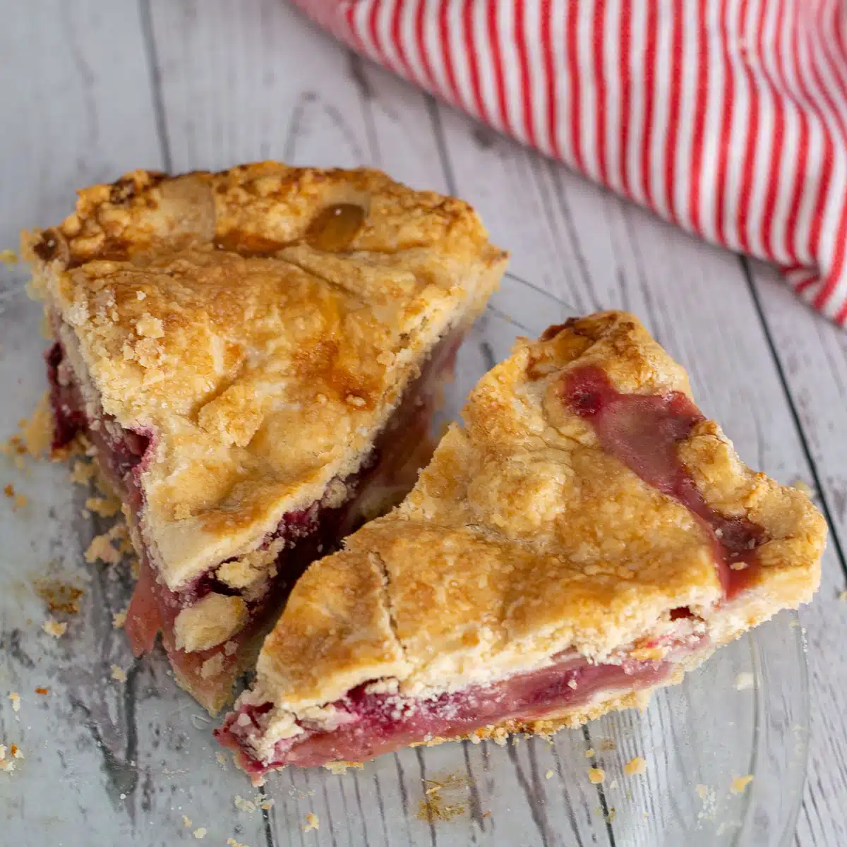 Square image of apple-cranberry pie slices.