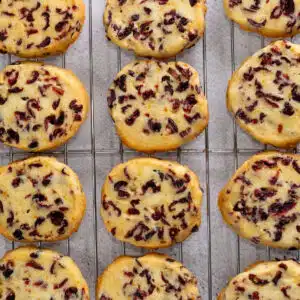 Square image showing cranberry orange shortbread cookies.