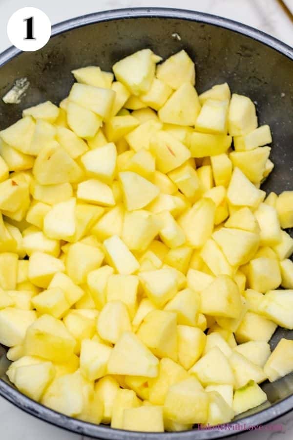 Dutch apple pie process photo 1 showing peeled and diced apples in a mixing bowl. 