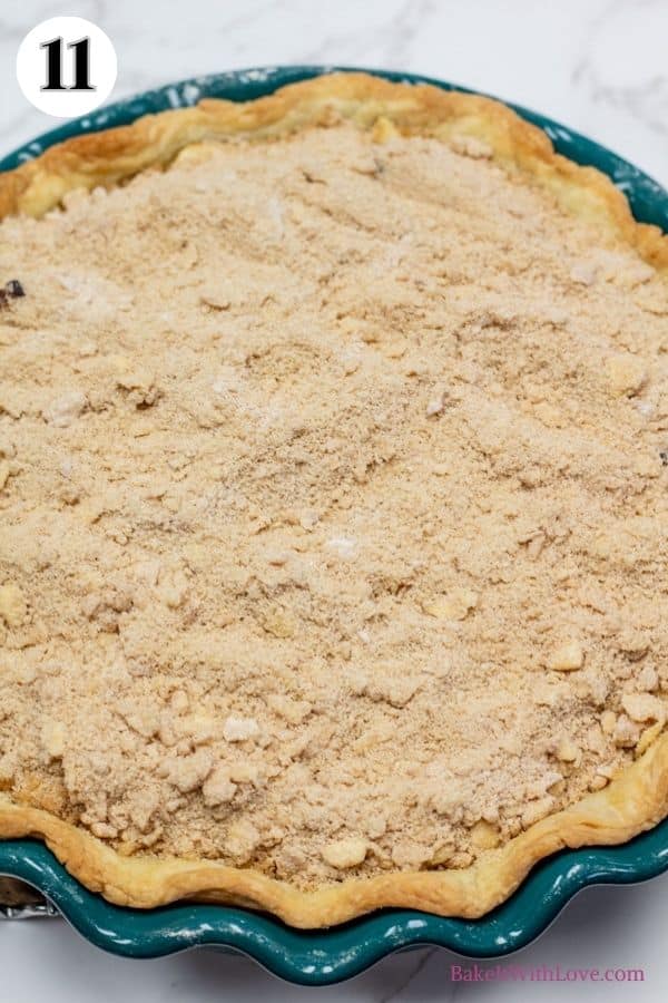 Dutch apple pie process photo 11 showing the streusel topping covering the top of the baked pie. 