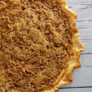 Square close up image showing dutch apple pie.