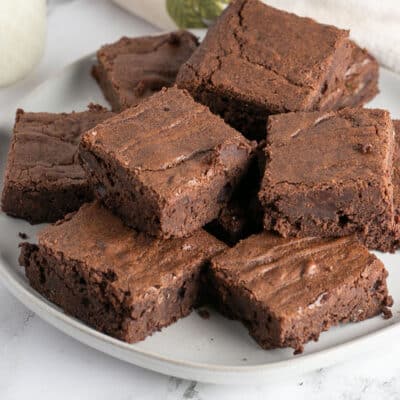 Square image showing a plate of fudge brownies.
