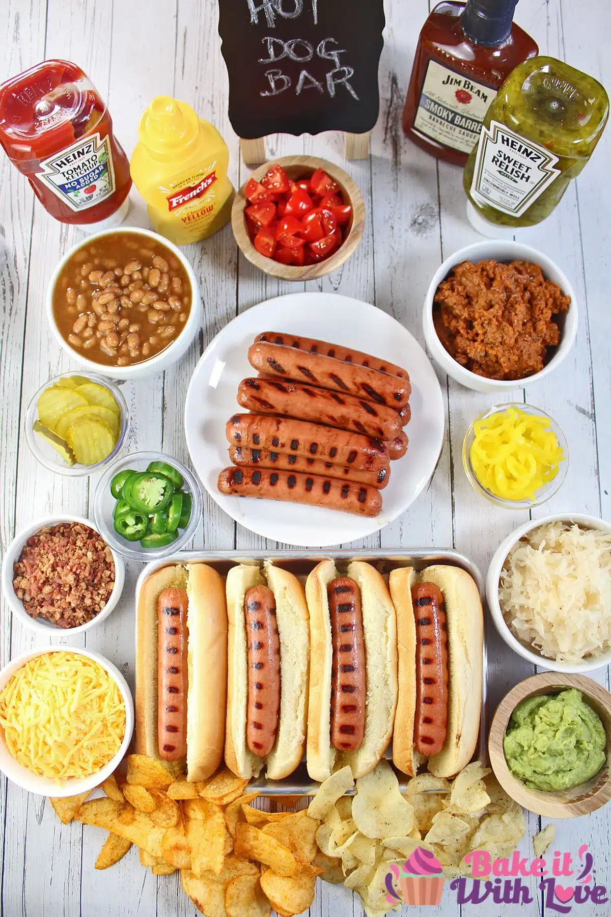 Hot dog bar essentials with condiments and bowls of favorite hot dog toppings ready to use.