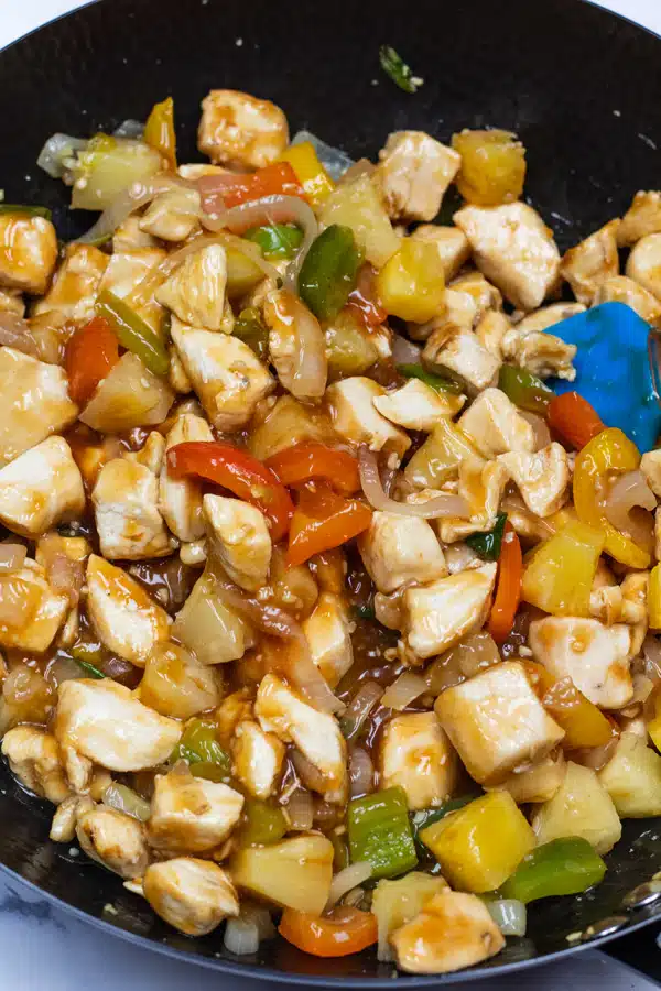 Meal prep sweet and sour chicken process photo 9 stir to coat then portion out into your meal prep containers.