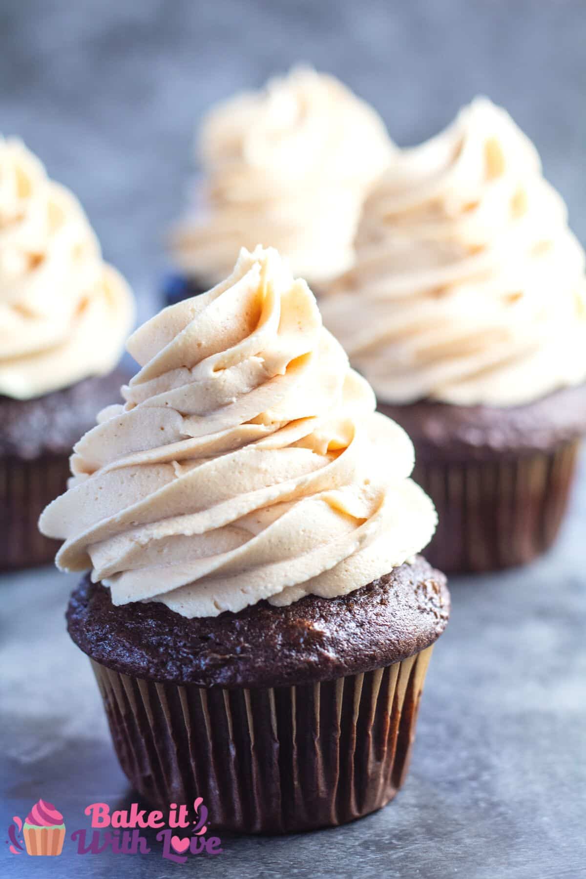 Tall image of a split open peanut butter filled chocolate cupcake.
