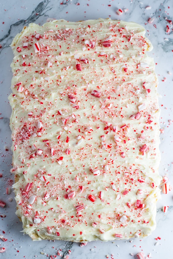 Peppermint sugar cookie bars process photo 12 spread over the baked sugar cookie bars and top with crushed candy canes.